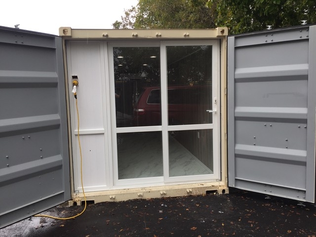 Shipping container with man doors
