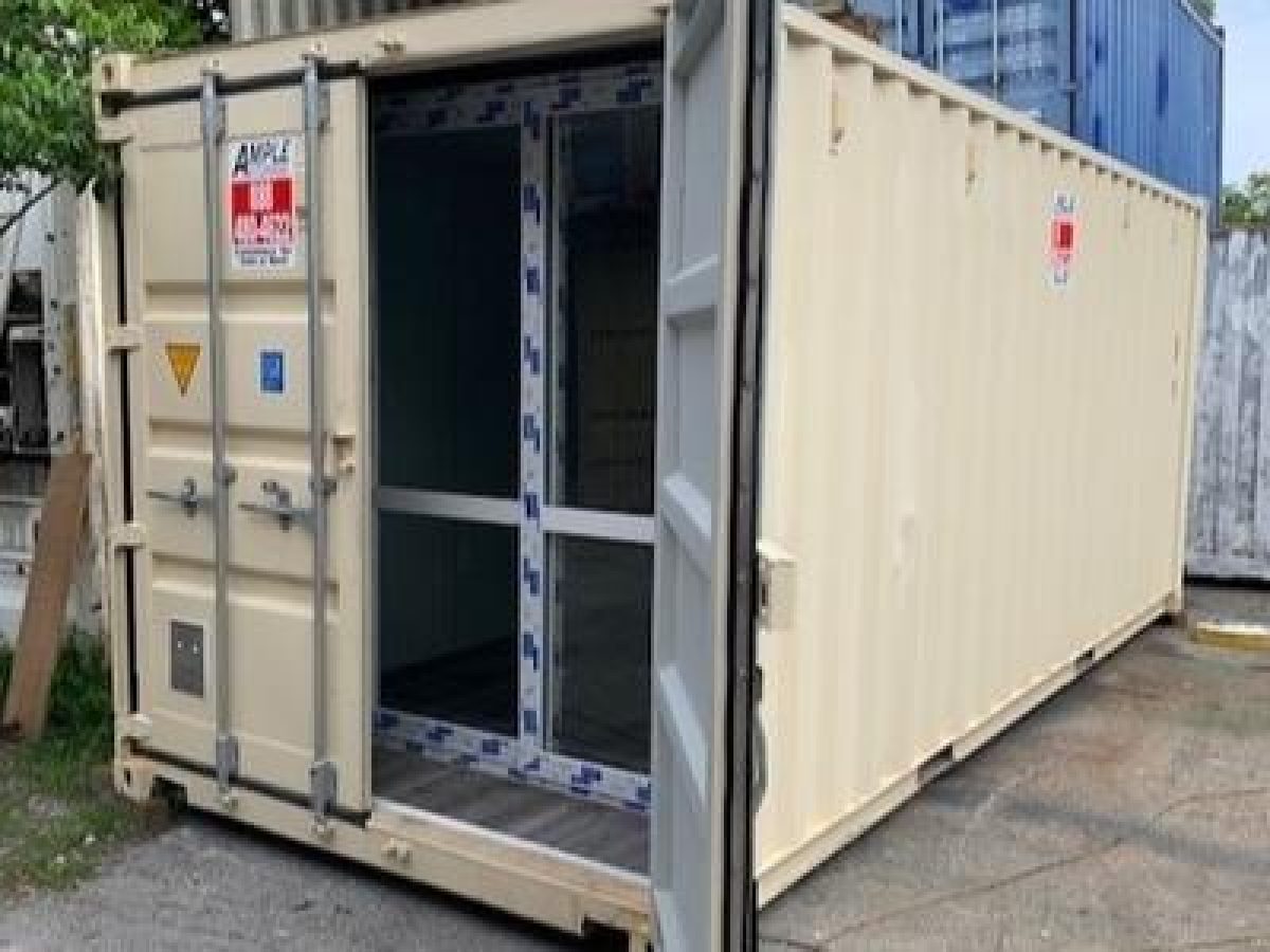 Shipping cpntainer with a sliding glass door