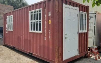 A red shipping container with a sliding window